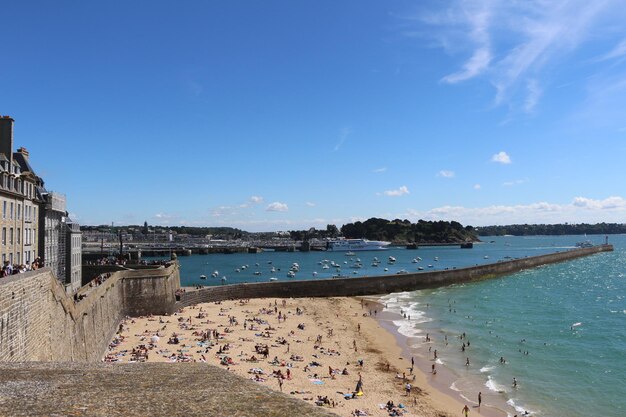 Scenic view of beach against blue sky