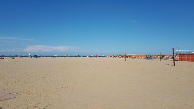 Scenic view of beach against blue sky