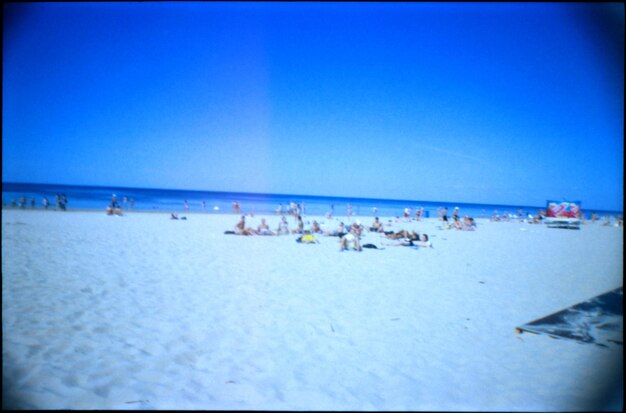 Scenic view of beach against blue sky