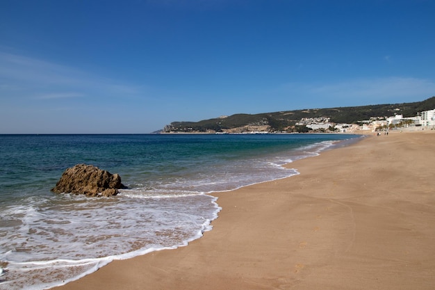 Photo scenic view of beach against blue sky