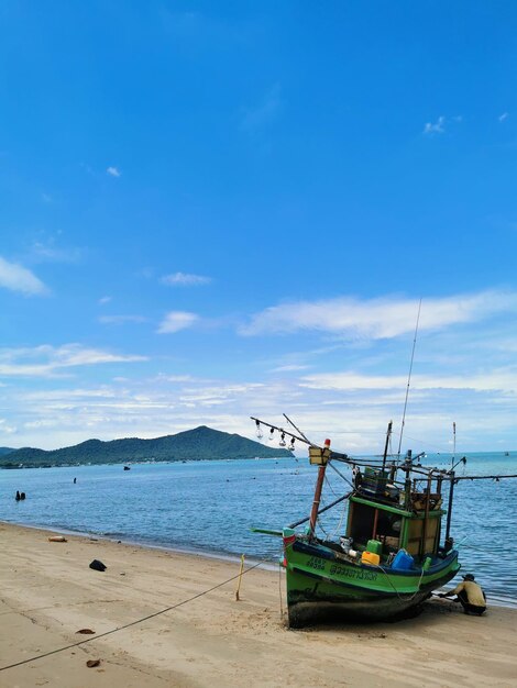 Scenic view of beach against blue sky