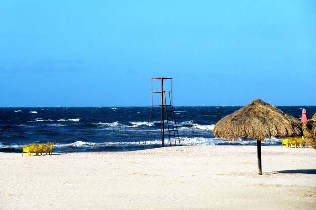 Photo scenic view of beach against clear blue sky