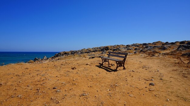 Scenic view of beach against clear blue sky