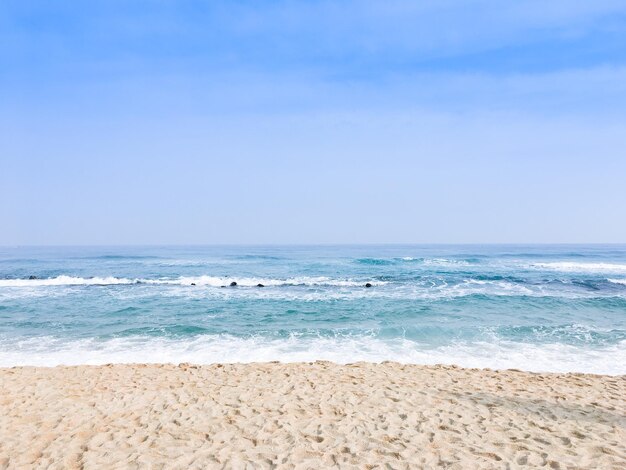 Photo scenic view of beach against clear blue sky