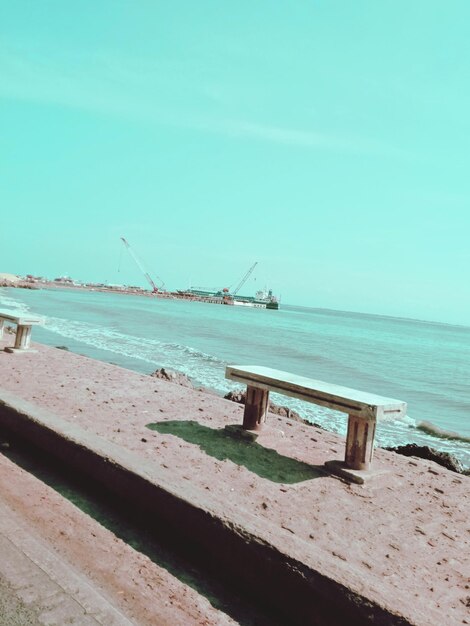 Scenic view of beach against clear sky