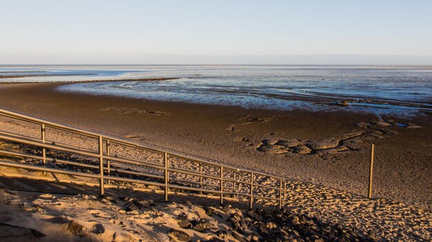 Scenic view of beach against clear sky