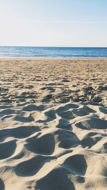 Photo scenic view of beach against clear sky