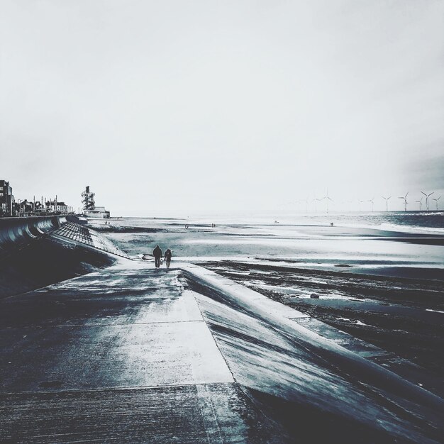 Photo scenic view of beach against clear sky