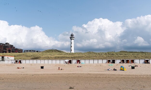 Photo scenic view of beach against cloudy sky