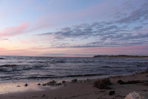 Scenic view of beach against dramatic sky