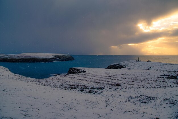 Scenic view of beach against sky during sunset