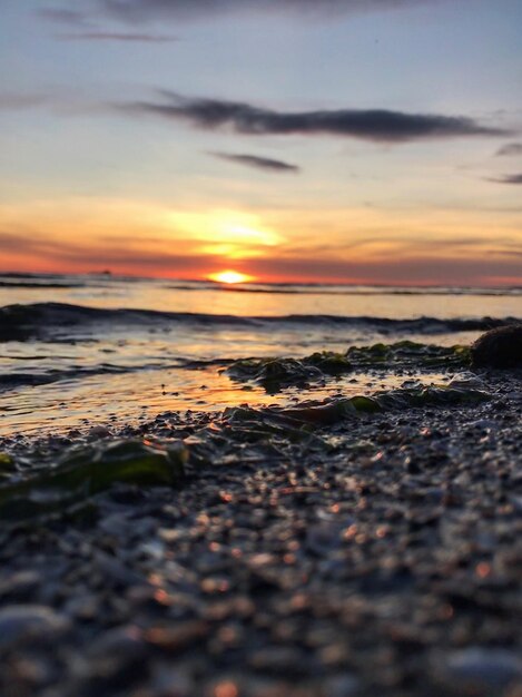 Scenic view of beach against sky during sunset