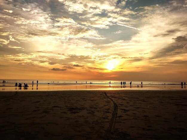 Scenic view of beach against sky during sunset