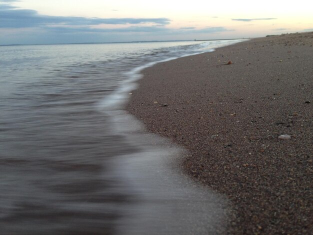 Scenic view of beach against sky during sunset