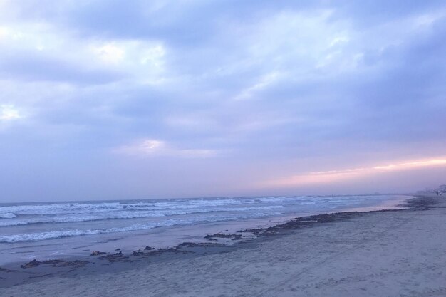 Scenic view of beach against sky during sunset