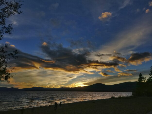 Scenic view of beach against sky during sunset