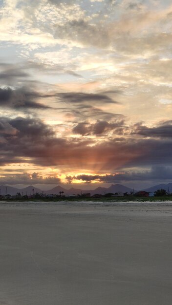 Scenic view of beach against sky during sunset