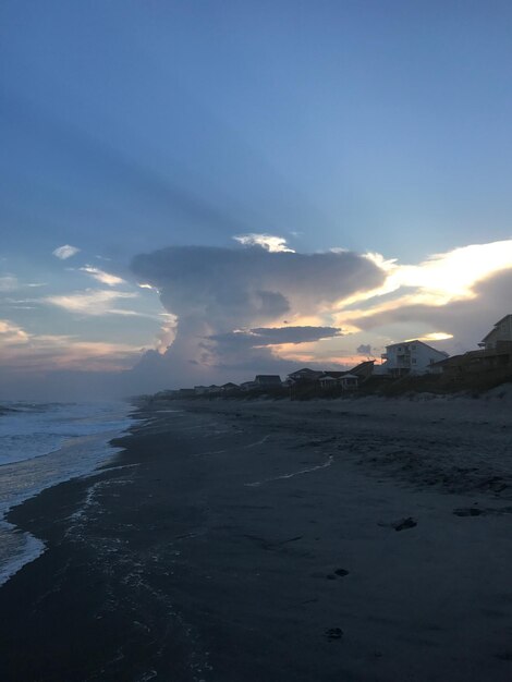 Scenic view of beach against sky during sunset