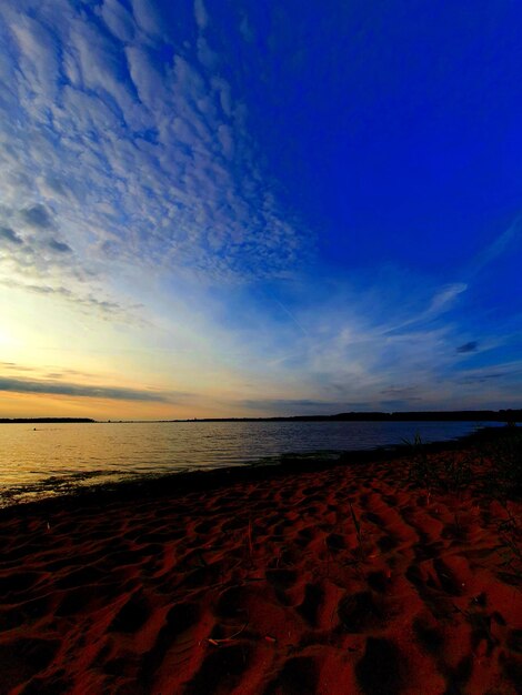 Scenic view of beach against sky during sunset