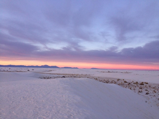 Scenic view of beach against sky during sunset