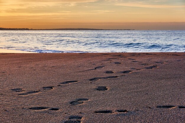 Scenic view of beach against sky during sunset