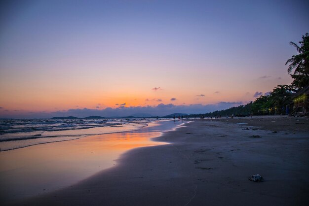 Scenic view of beach against sky during sunset