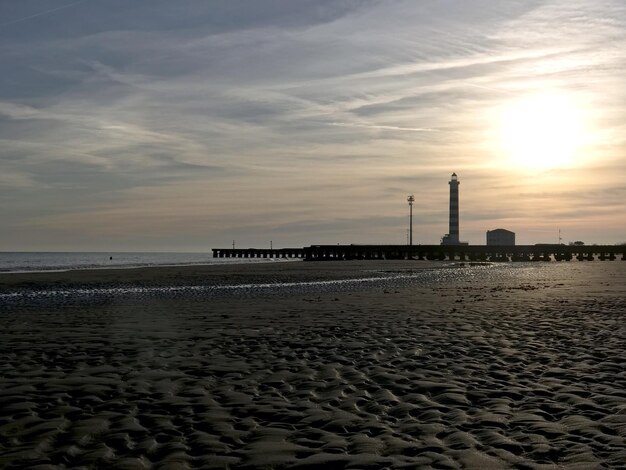 Scenic view of beach against sky during sunset