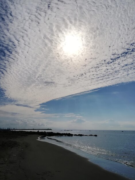 Scenic view of beach against sky during sunset