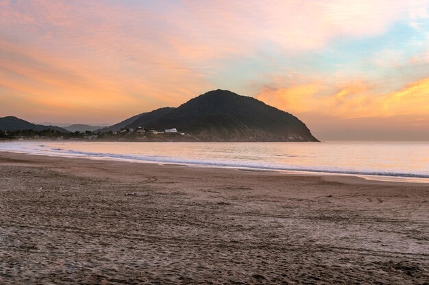 Scenic view of beach against sky during sunset