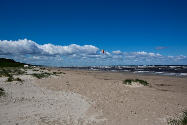 Scenic view of beach against sky and lonely kite on jurmala beach