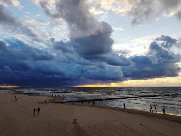 Scenic view of beach against sky during sunset