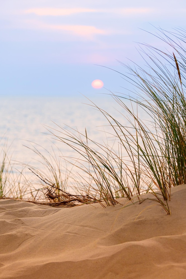 Photo scenic view of beach against sky during sunset