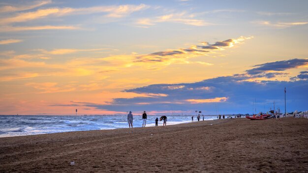 Scenic view of beach against sky during sunset