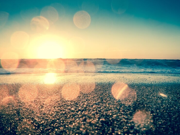 Photo scenic view of beach against sky during sunset