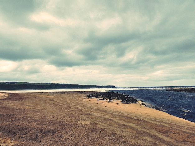 Photo scenic view of beach against sky