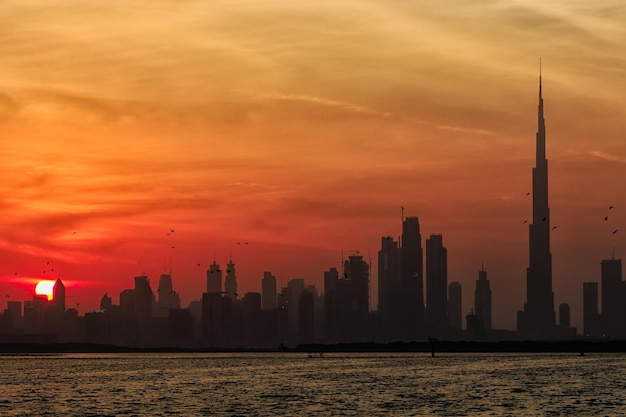 Scenic view of buildings against sky during sunset