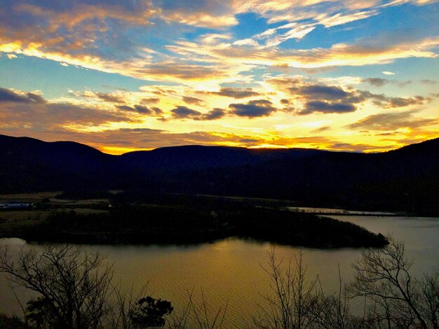 Scenic view of calm lake against mountain range