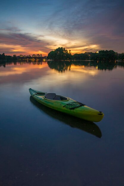 Scenic view of calm lake at sunset