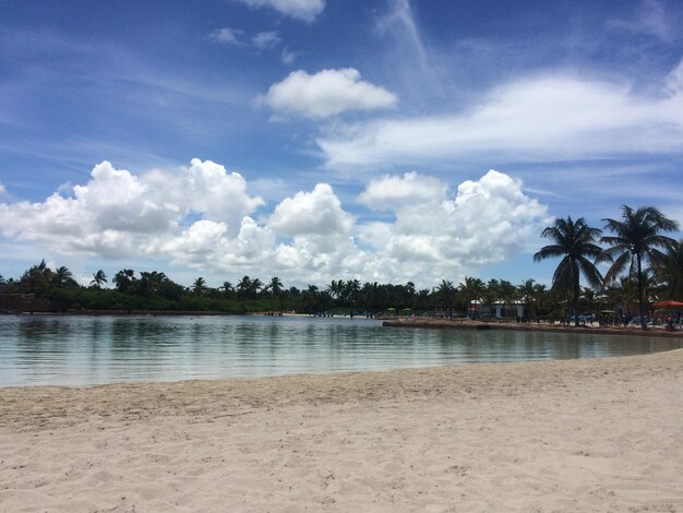 Scenic view of calm sea against cloudy sky