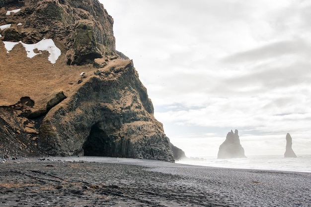 scenic view of a cave on a beach against sea