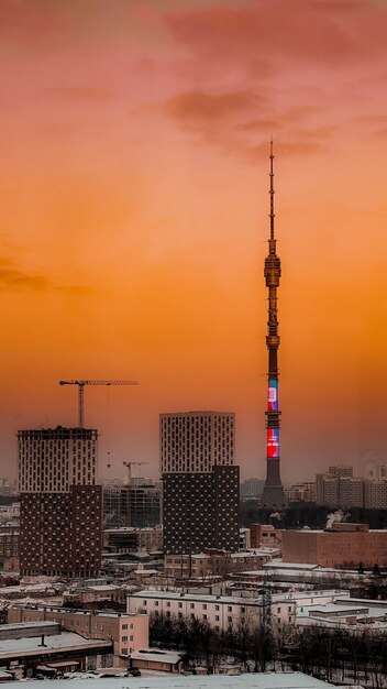 Scenic view of city against sky during sunset