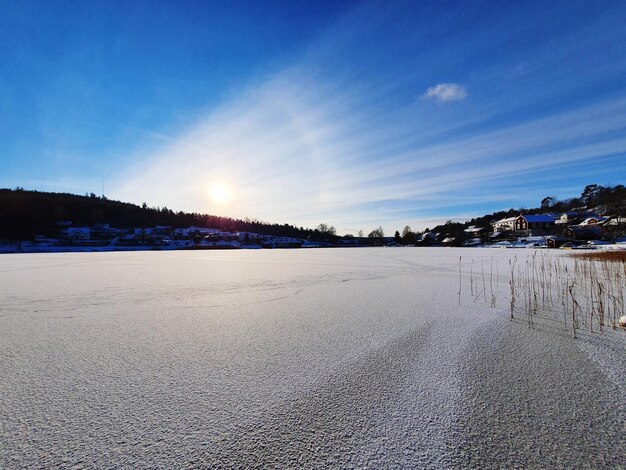 Scenic view of city during winter against sky