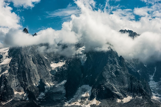 Scenic view of clouds and mountains against sky