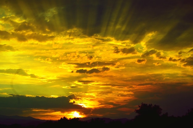 Scenic view of cloudy sky at sunset