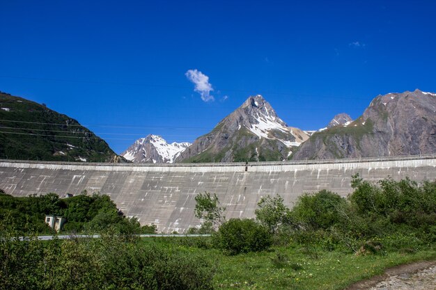 Scenic view of dam against blue sky