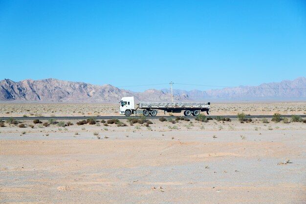 Scenic view of desert against clear blue sky