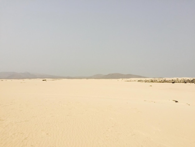 Scenic view of desert against clear sky