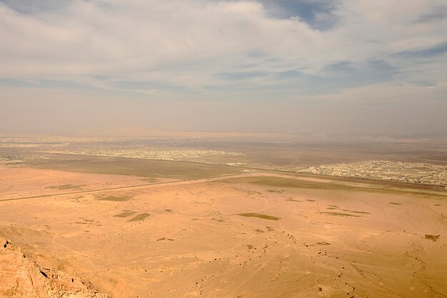 Scenic view of desert against sky during sunset