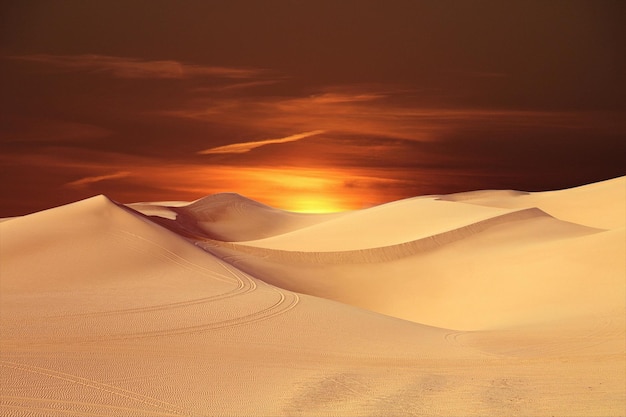 Scenic view of desert against sky during sunset