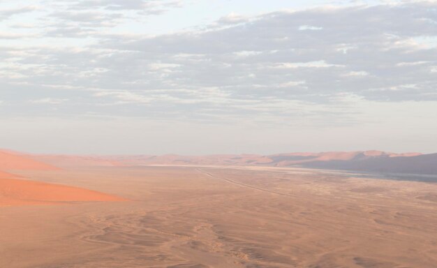 Photo scenic view of desert against sky